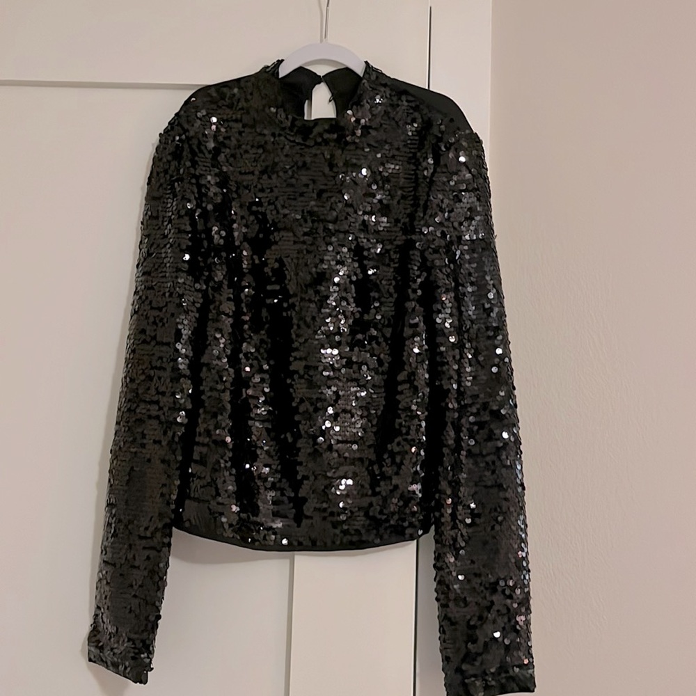 Sequined long sleeved blouse. High neck. Worn once.